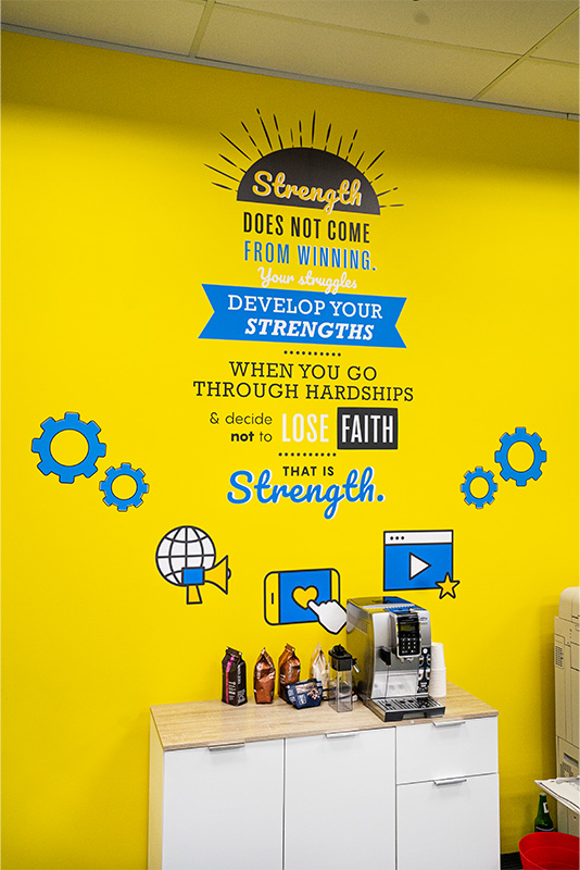 Motivational Quote about Strength and Faith on wall at FirstCom Solutions Singapore office 