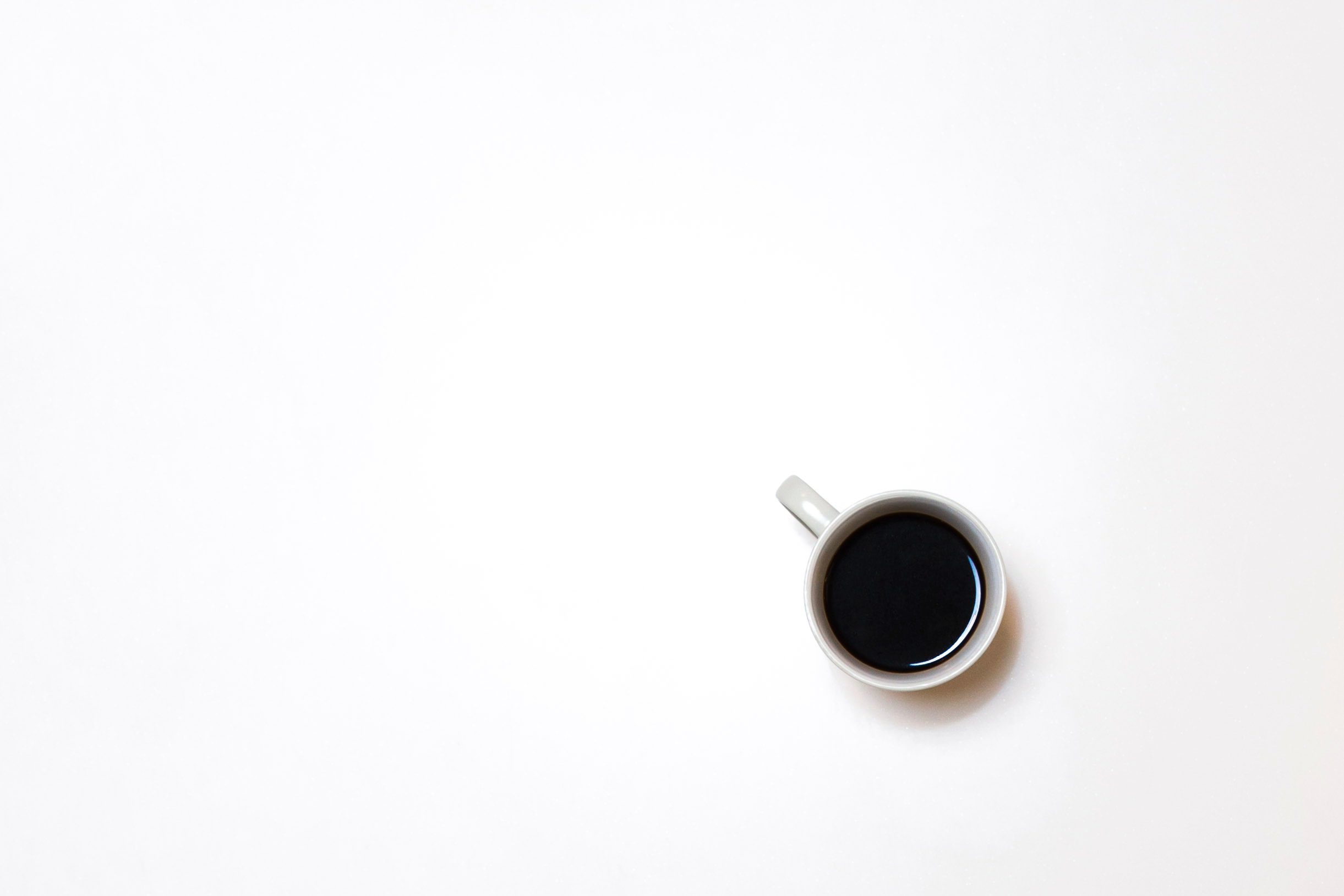 Example of negative space using a photograph of a cup of coffee on a blank canvas
